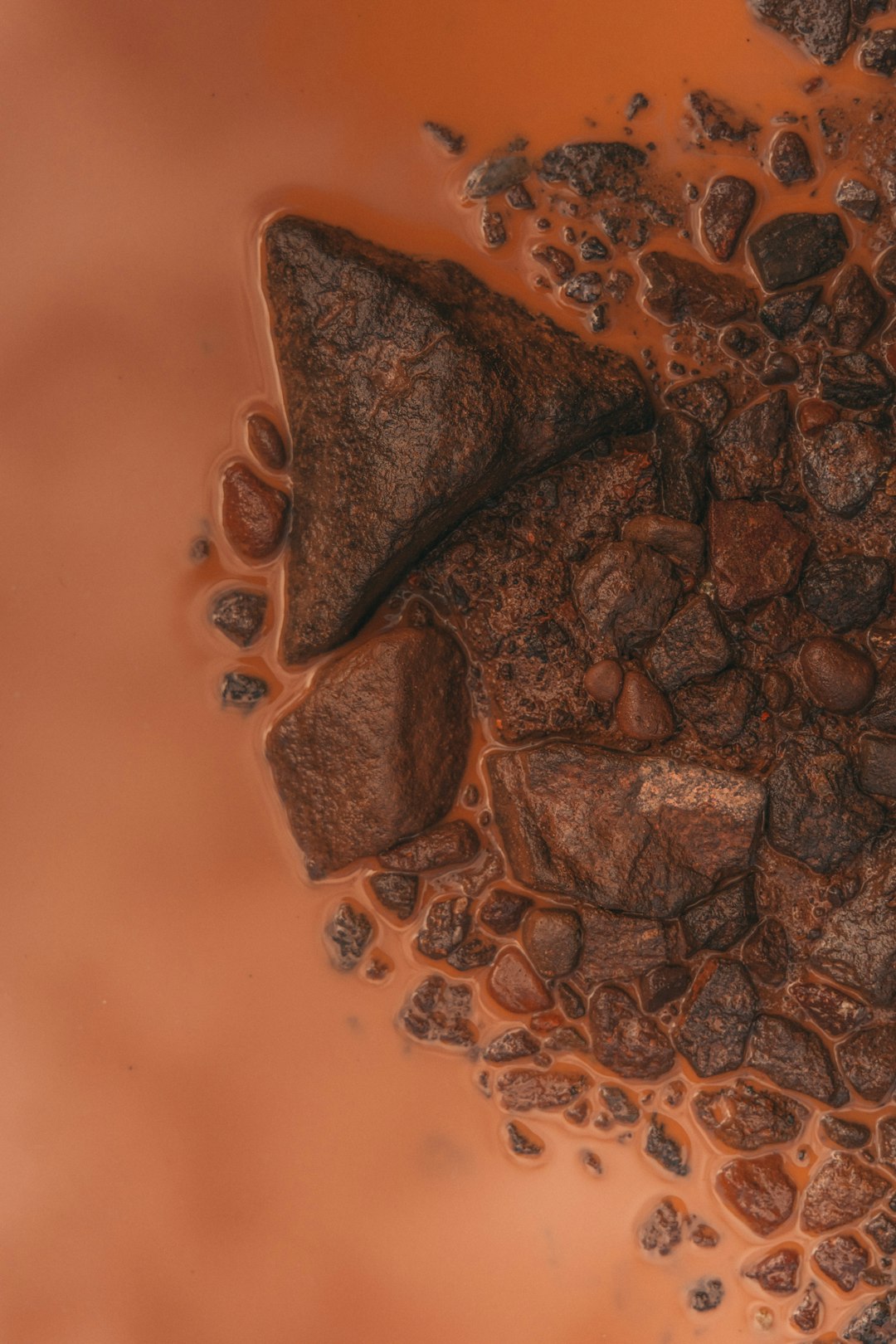 some rocks and water in a puddle